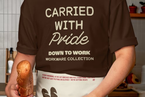 Brown shirt back view Carried with Pride text showing cream apron customizable workwear template