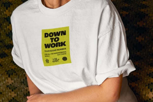 White tee front with yellow graphic patch centered