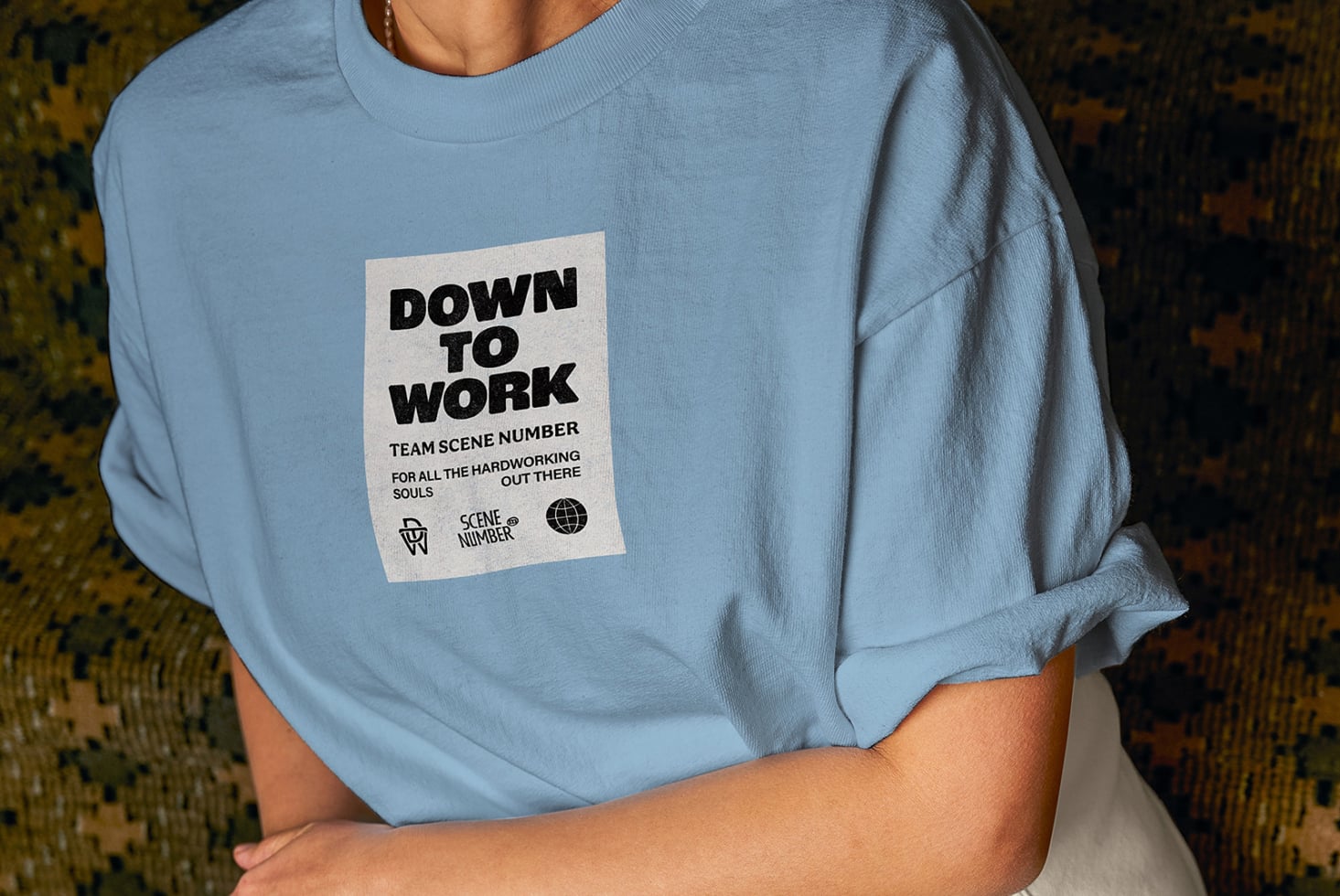 Blue crewneck tee front view with cream graphic patch