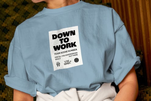 Blue sweatshirt showing back with cream graphic patch