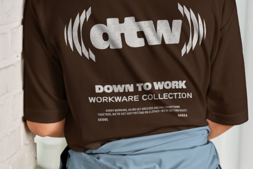 Back view of brown sweatshirt with dtw logo, down to work text, light blue pants