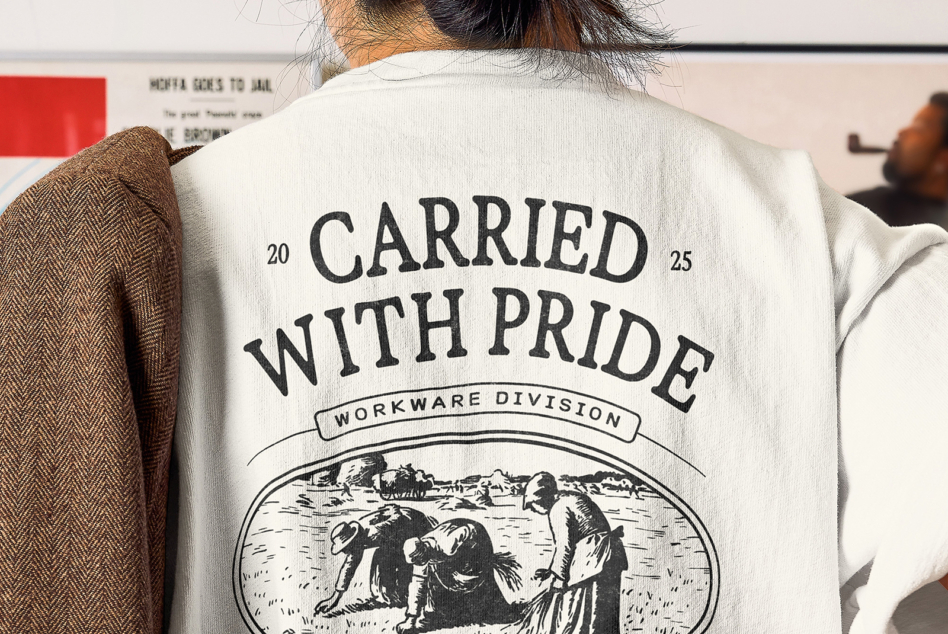 Cream tee featuring Carried With Pride large text over landscape engraving illustration