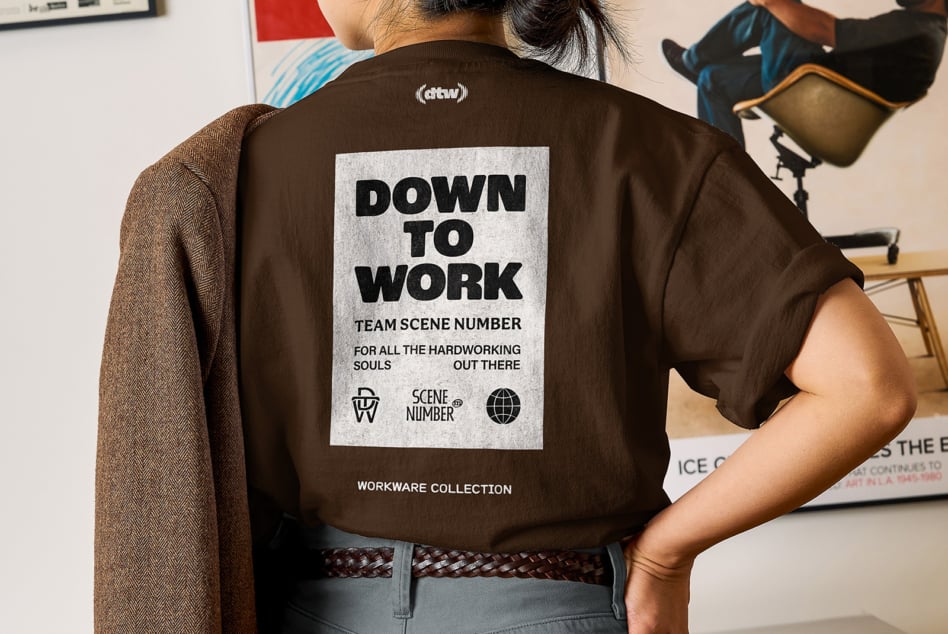 Brown shirt back displaying Down To Work text on light rectangular patch placement