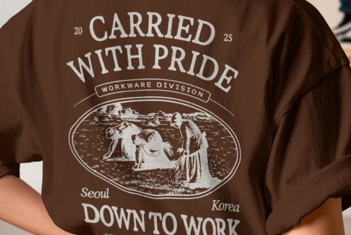 Close up of brown tee back showing Carried With Pride vintage workwear print