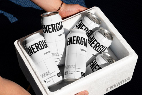 White foam cooler full of white ENERGIA cans being lifted by hand