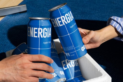 Two people cheers with white ENERGIA cans on blue textured background