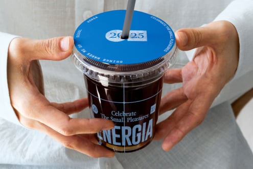 Beverage cup with bright blue lid, dark straw, date badge 20-25