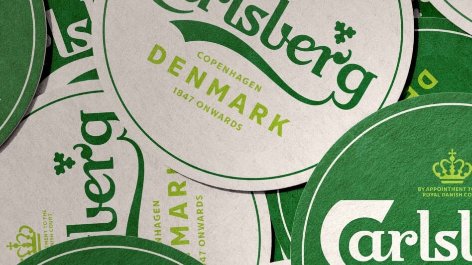 Carlsberg beer bottle labels in green, cream overlapping circles with Danish branding