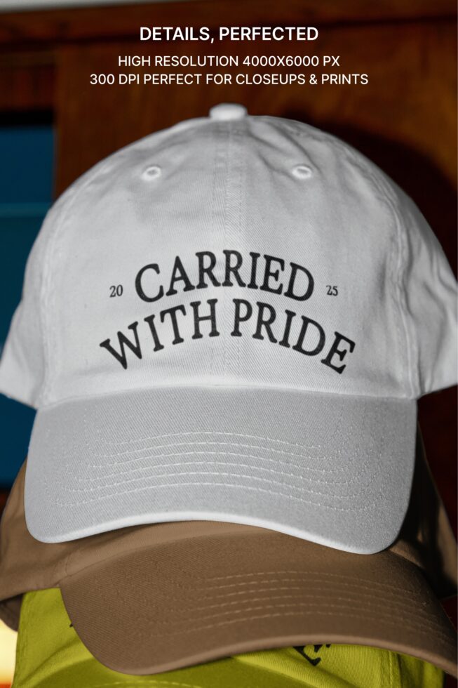 White baseball cap with two-tone brown visor printed 'carried with pride' text design