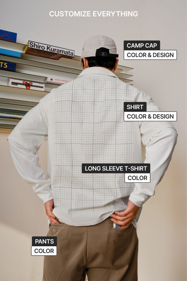 Rear view of model showing layered outfit with customizable camp cap, shirt, long sleeve tee, pants display mockup