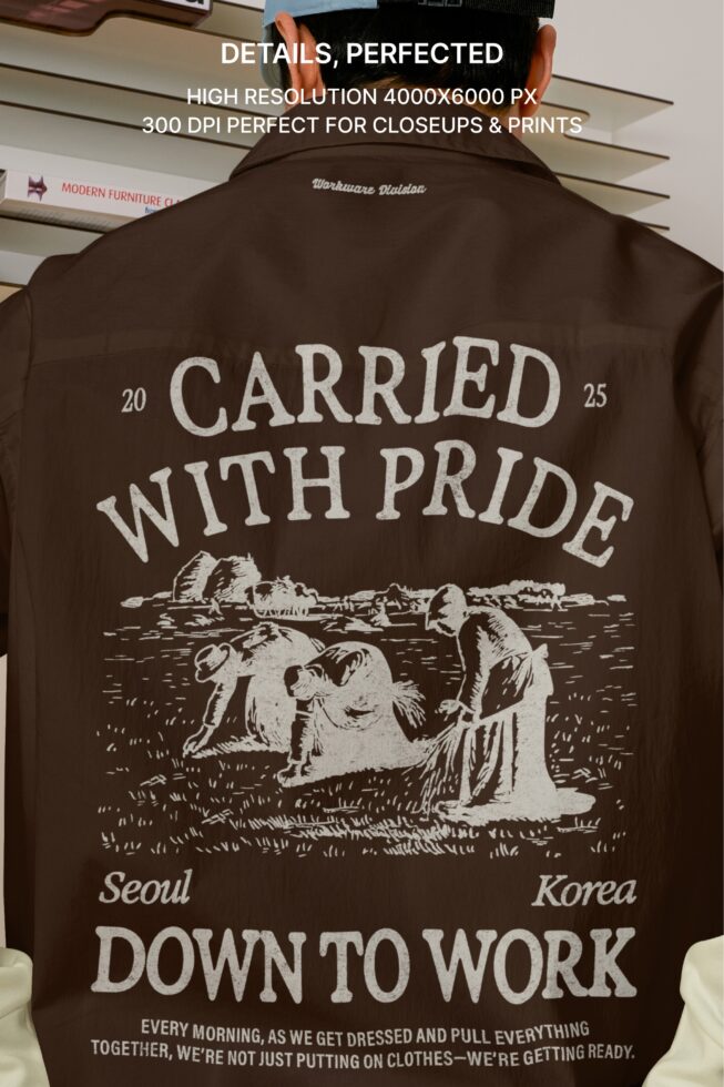 Person from behind wearing brown shirt jacket with 'Carried with pride' back print over work vest from Scene Number collection