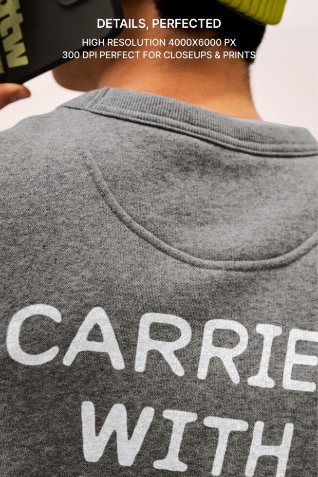 Overhead shot of gray crewneck sweatshirt showing shoulder seam detail up close