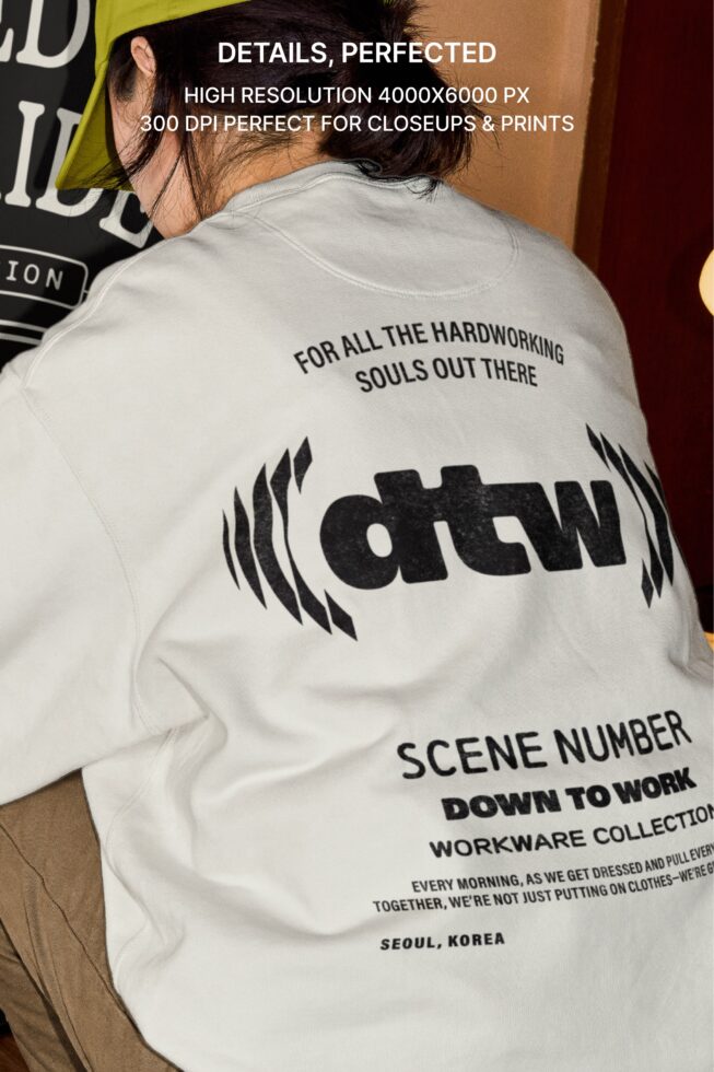 Back view of white t-shirt with Down to Work graphic design on male model