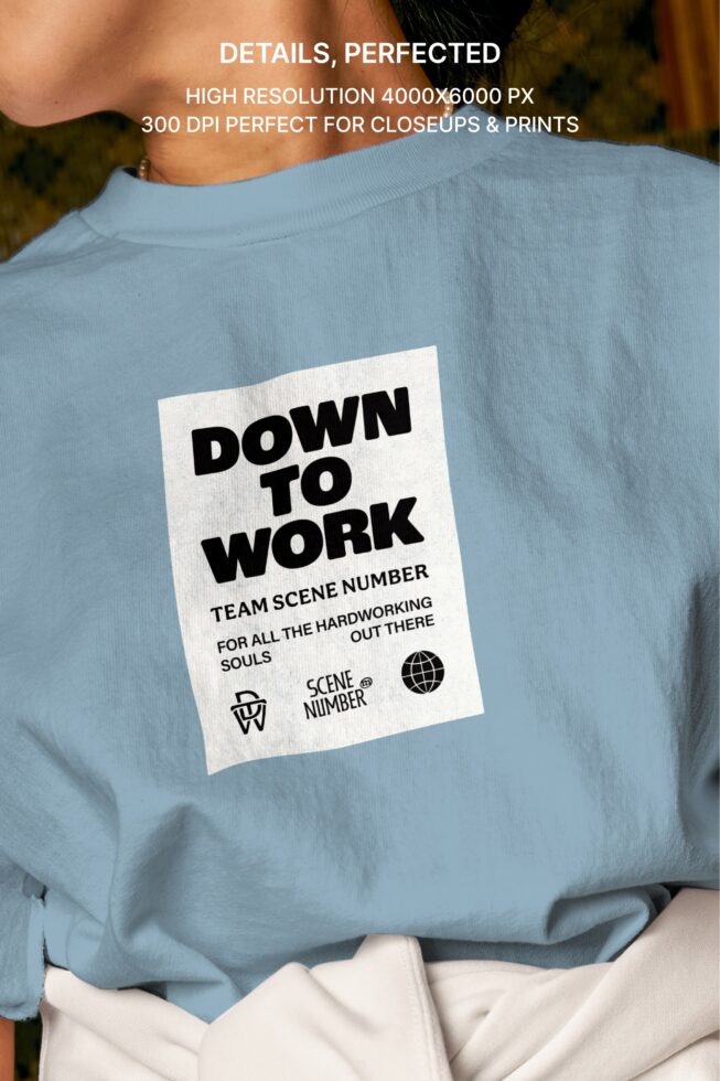 Back view of light blue crewneck with Down to Work label patch centered on shoulders