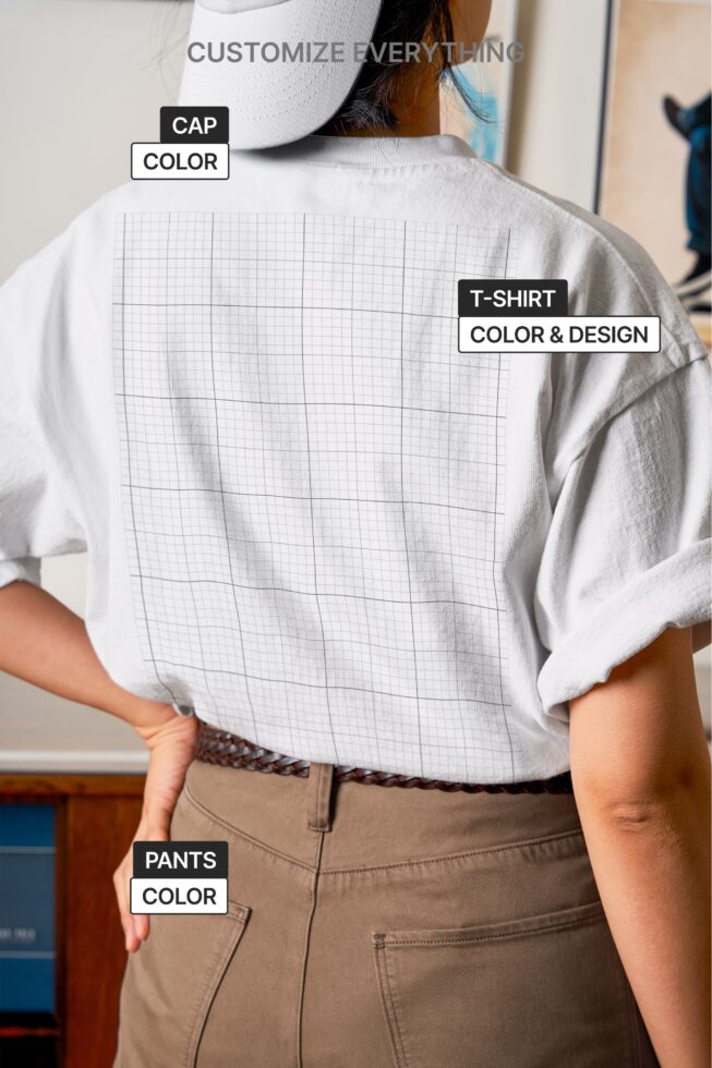 Back view of model wearing white tee with grid print, tan cap, tan pants