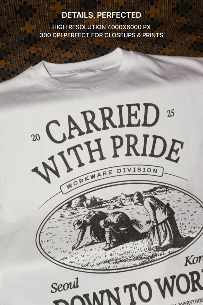 Close up of cream tee neckline showing vintage farm engraving graphic detail