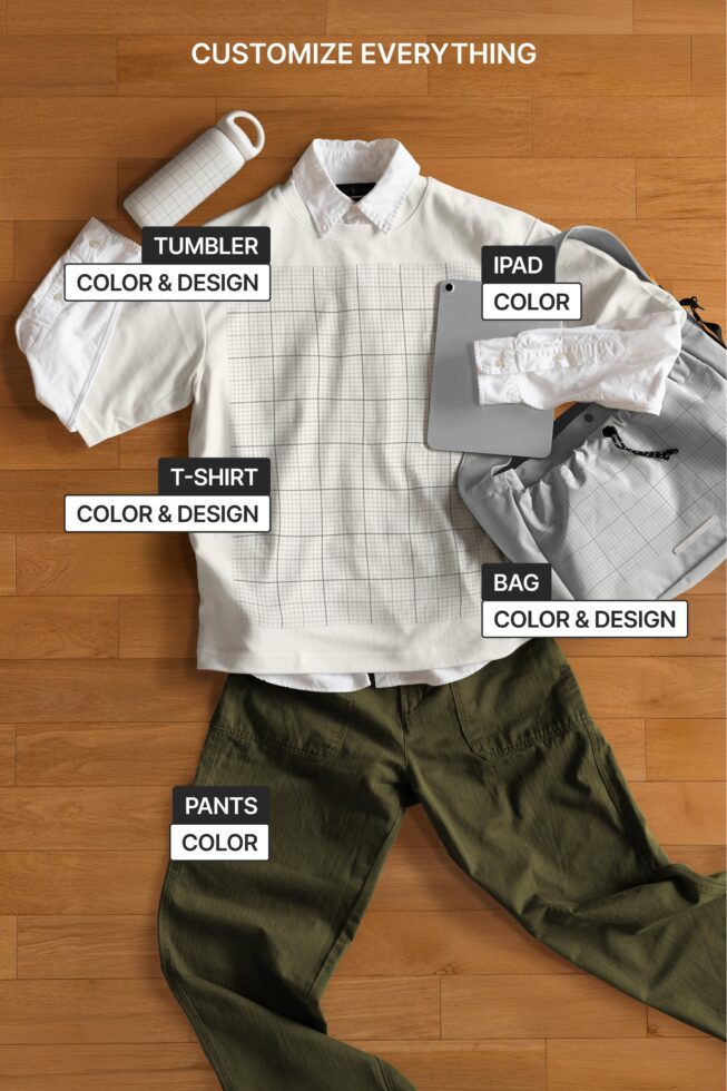Flat lay of apparel mockups showing customizable shirt, pants, bag, tablet, tumbler