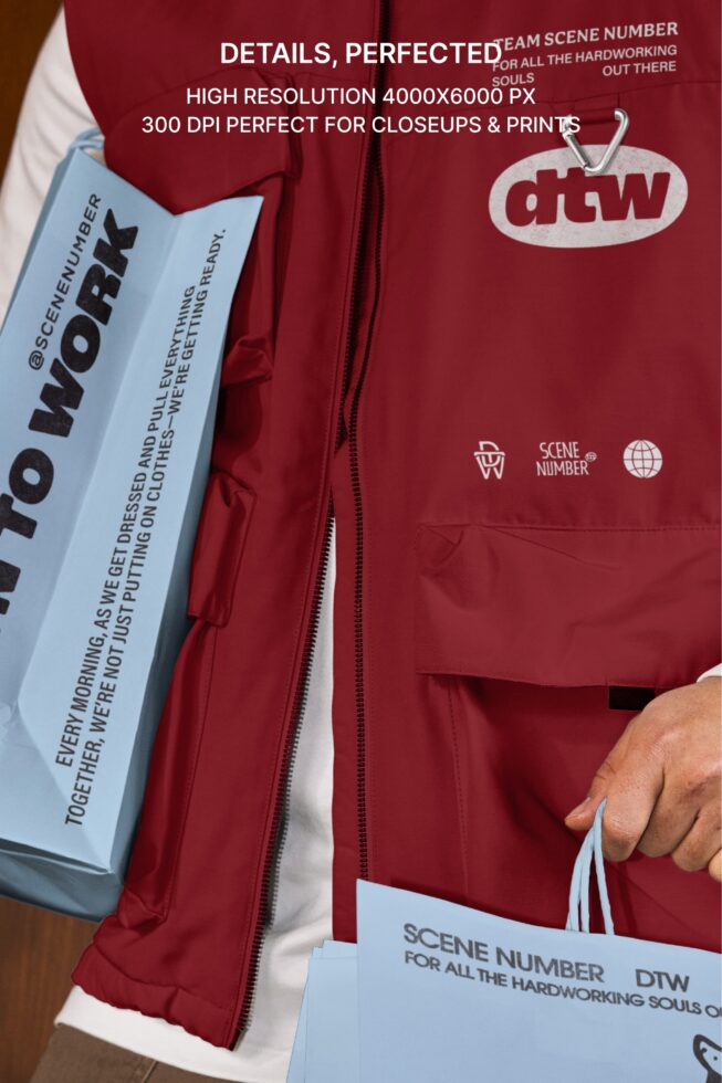 Burgundy puffer vest with white dtw logo, light blue tag, shown on model