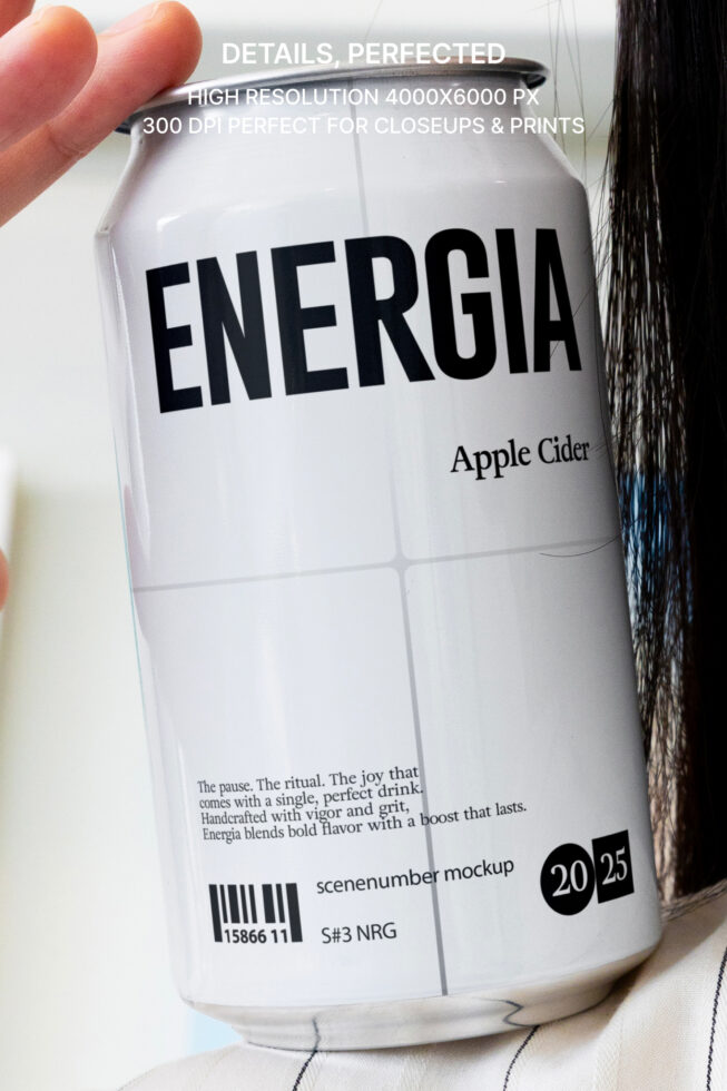 Hand holding white Energia apple cider can pulled from fabric