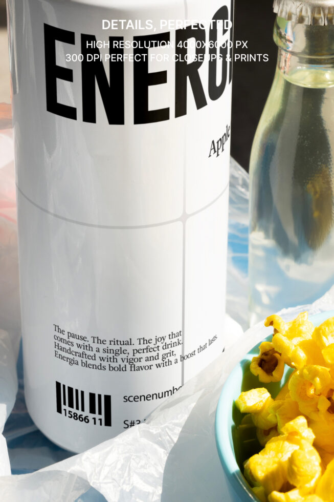 Close-up of Energia beverage bottle label with popcorn bowl backdrop