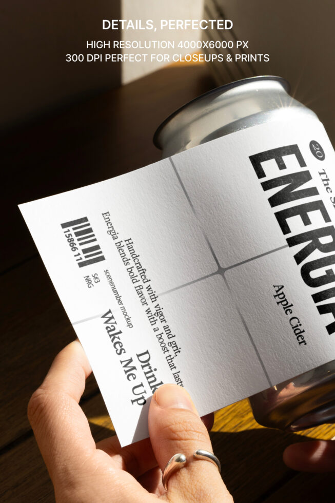 Close-up of aluminum can with white label showing barcode, text details, 4000x6000px resolution