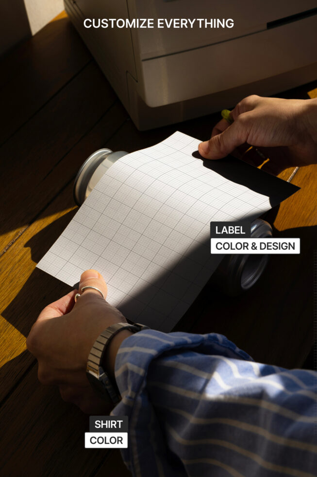 Hands holding printable can label mockup with grid pattern, showing customizable label, color options