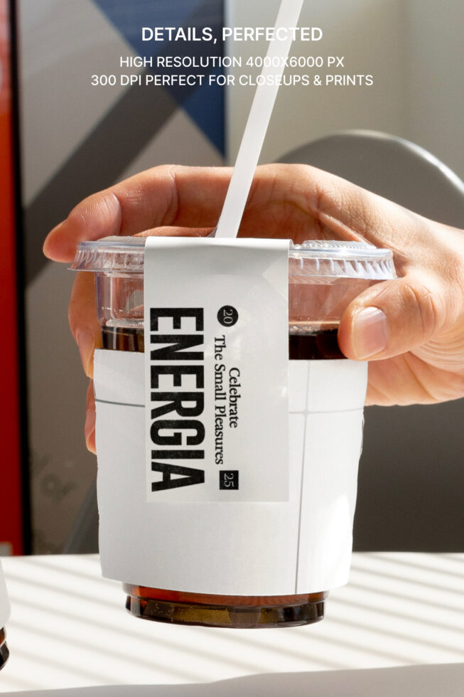 Close-up of cup sleeve mockup with straw showing Energia text on beverage