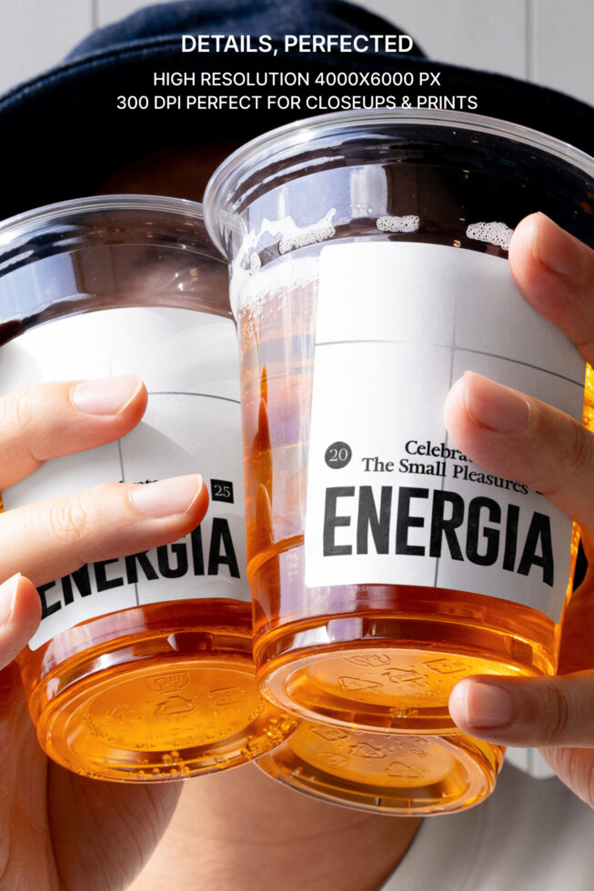 Two clear jars with amber liquid held in hands, white labels showing Energia branding