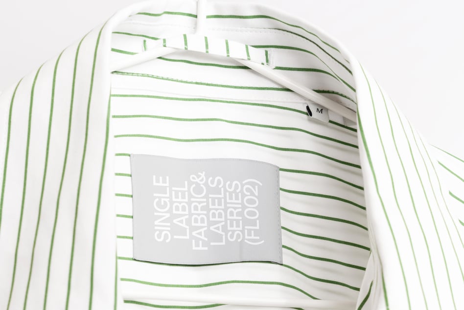 Striped white shirt with green horizontal lines showing gray hang tag mockup
