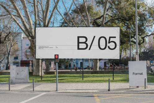 Large outdoor billboard mockup with B/05 text in park setting among trees