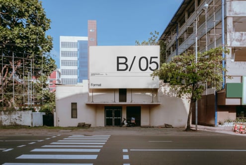 White signage on building with B/05 title, Format text below in minimal layout