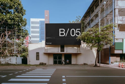 Dark horizontal billboard on storefront displaying B/05 alongside Format logotype