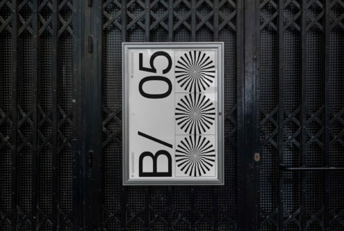 Poster mockup with light background against dark metal grid wall