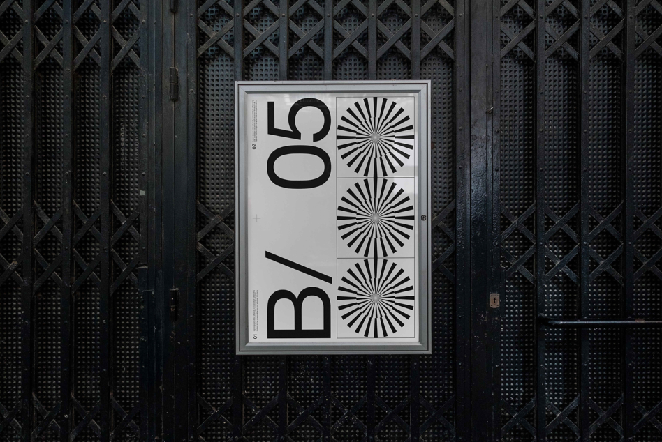 Poster mockup with light background against dark metal grid wall
