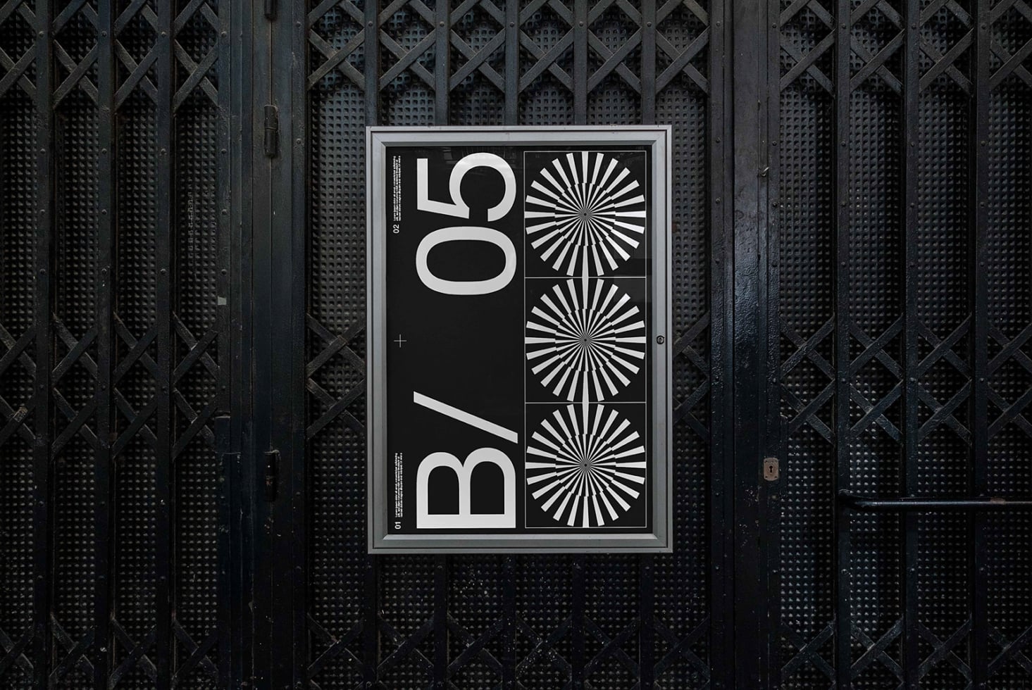 Dark poster mockup displayed on industrial metal mesh wall surface