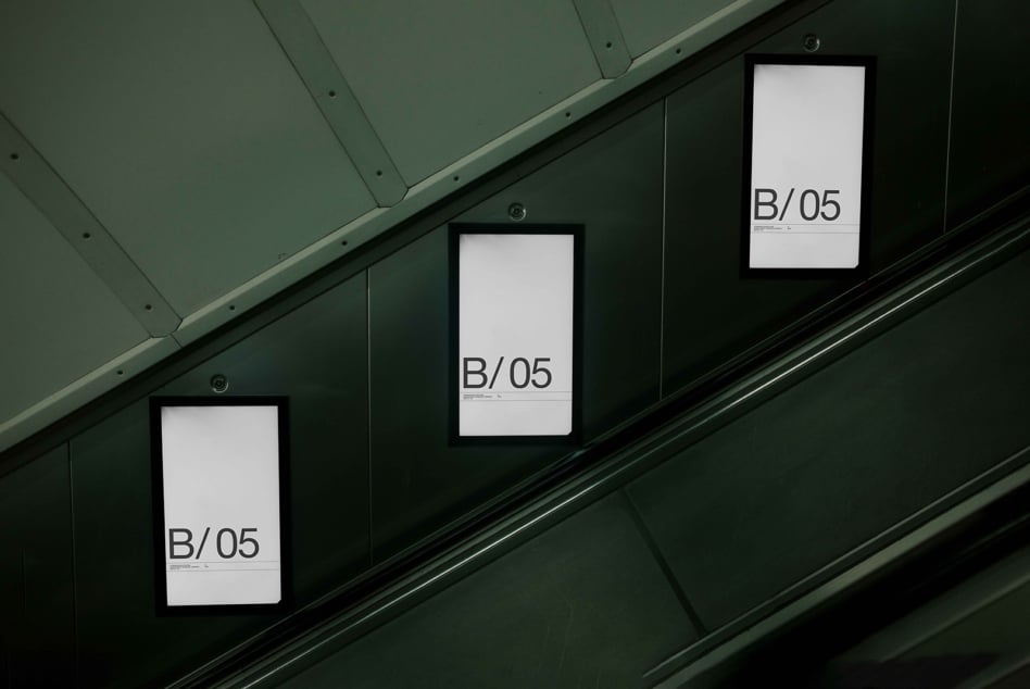 Bright gallery sign mockups on steel walls with B/05 text displayed on white panels