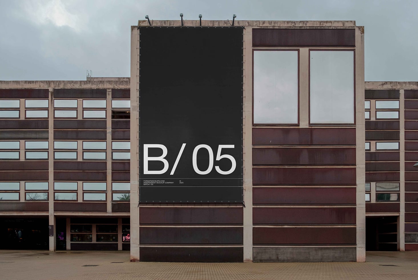Black billboard mockup displaying B/05 on concrete brutalist architecture