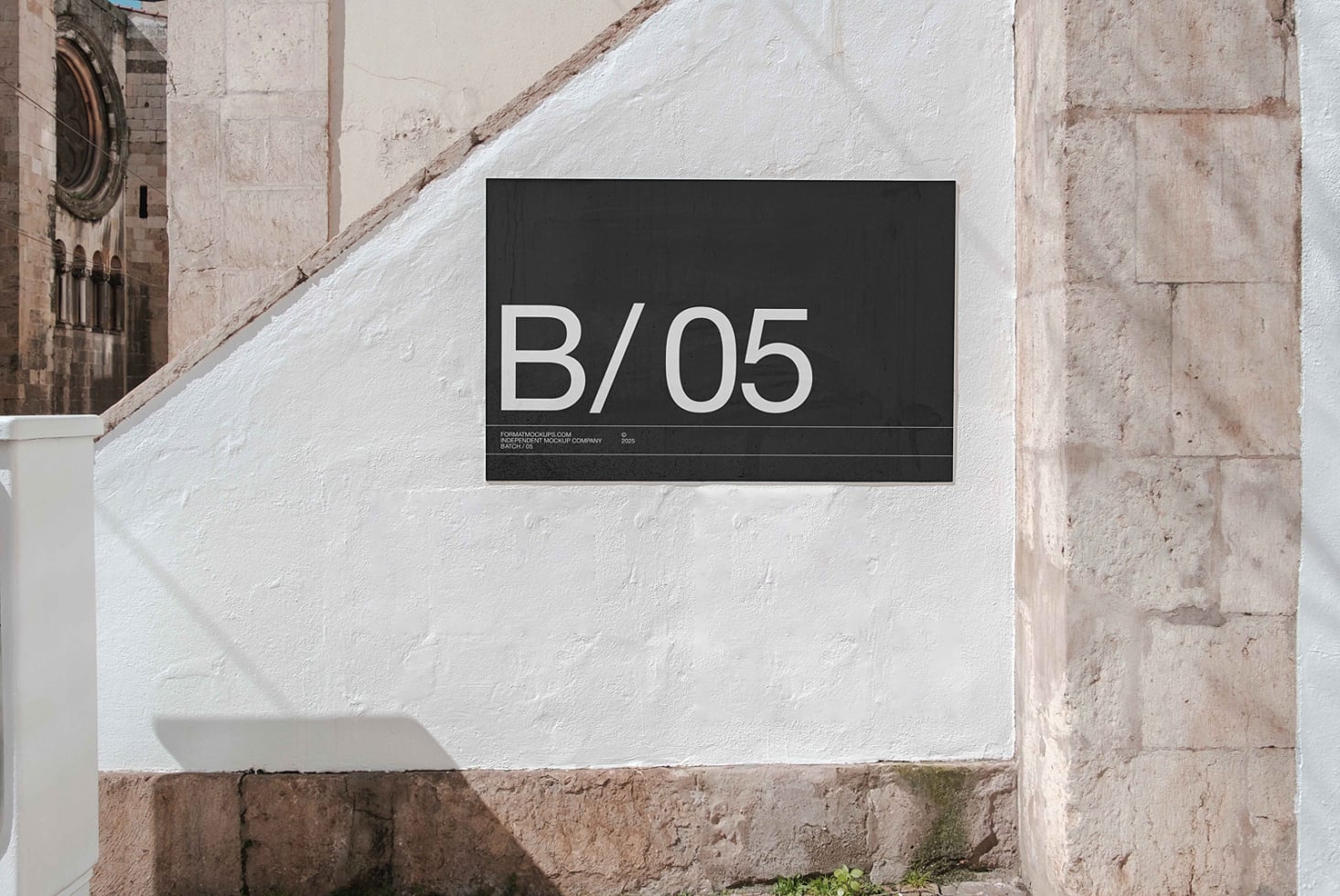 Dark horizontal sign mockup with B/05 text on weathered whitewashed stone wall