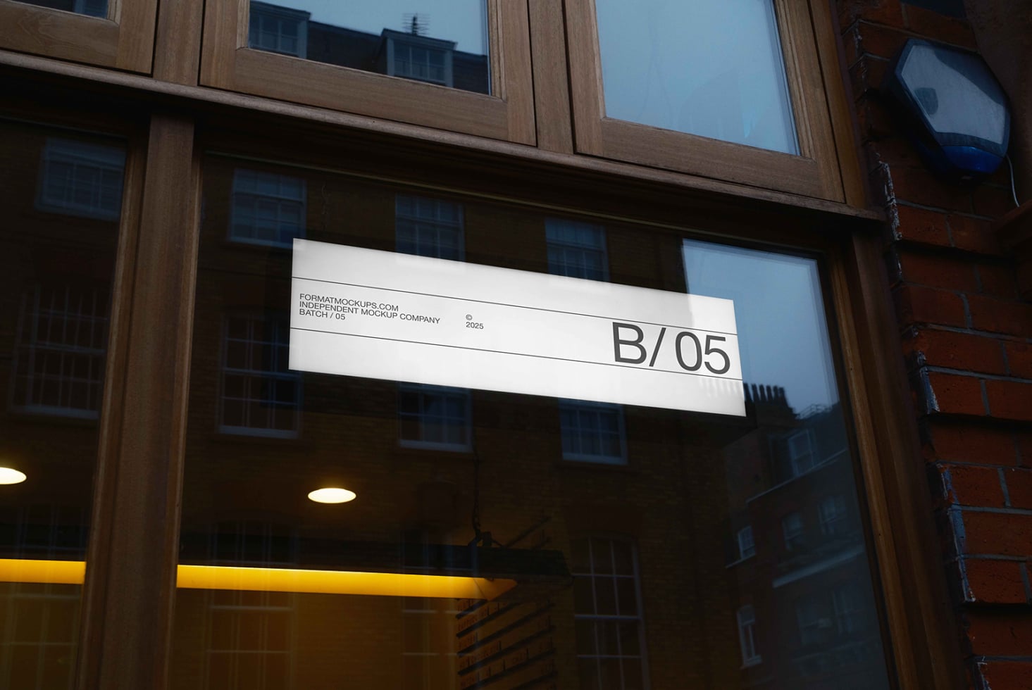 Horizontal storefront sign with B/05 text on wood building with glass windows