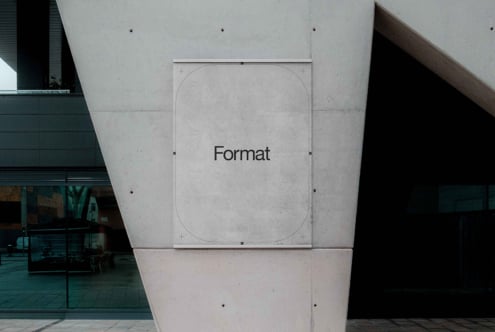 White square wall sign mockup on concrete brutalist architecture interior