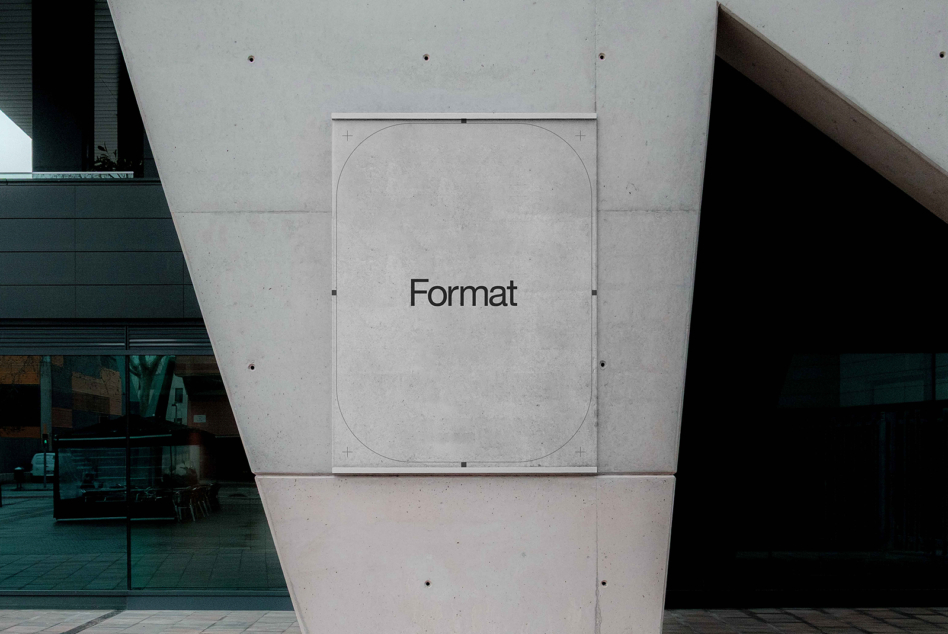 White square wall sign mockup on concrete brutalist architecture interior