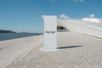 White vertical sign mockup on waterfront promenade overlooking harbor