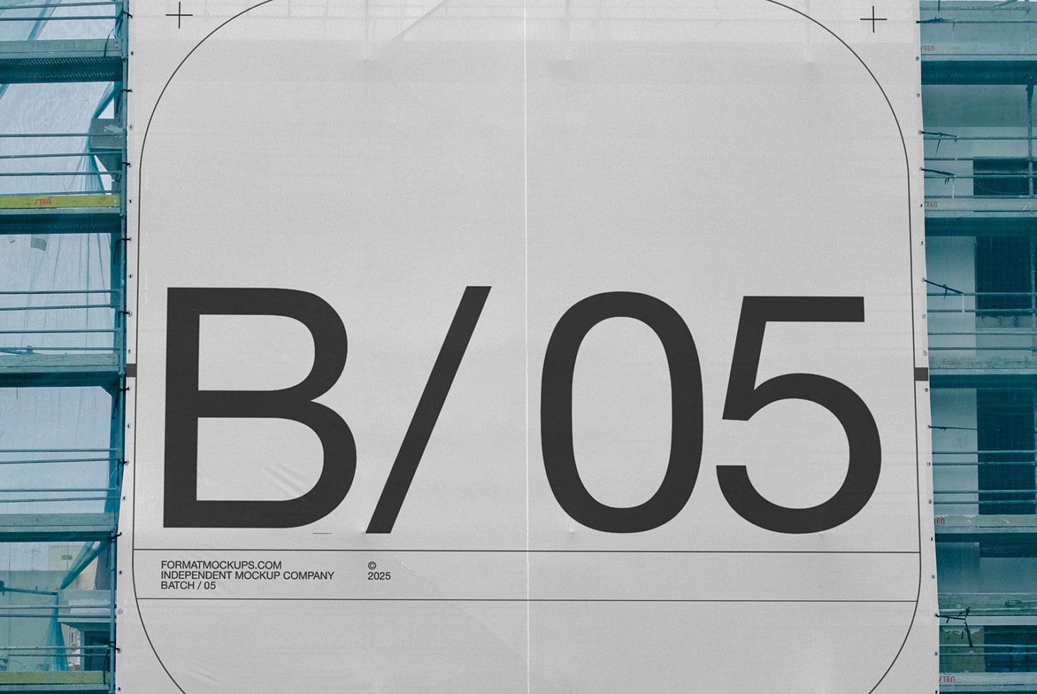 Close-up of industrial building wrap displaying large letterforms on white