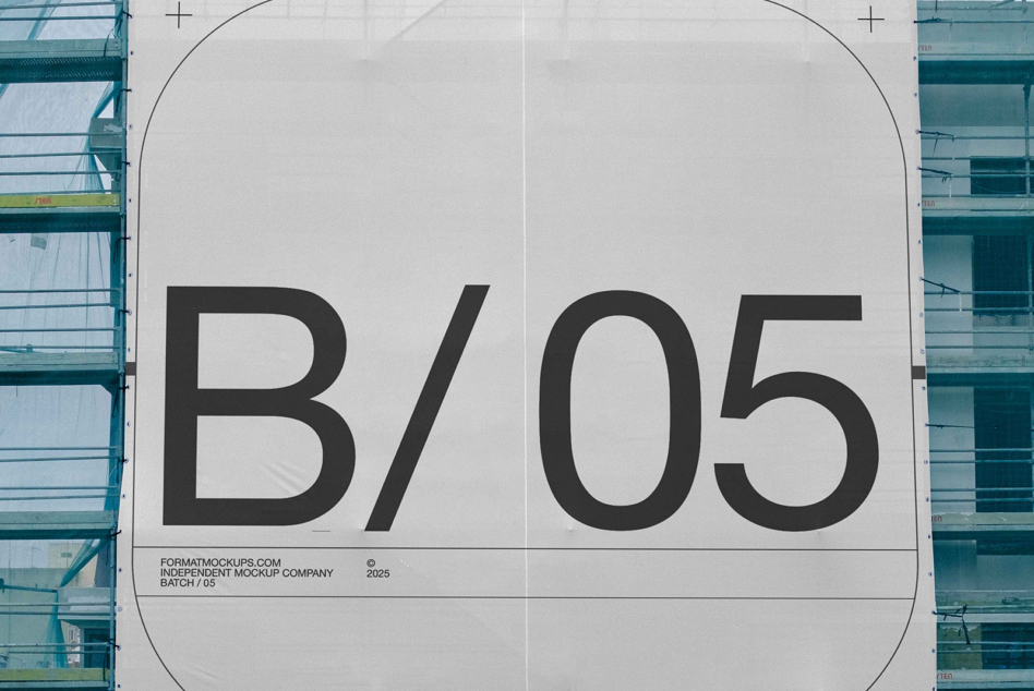 Close-up of industrial building wrap displaying large letterforms on white