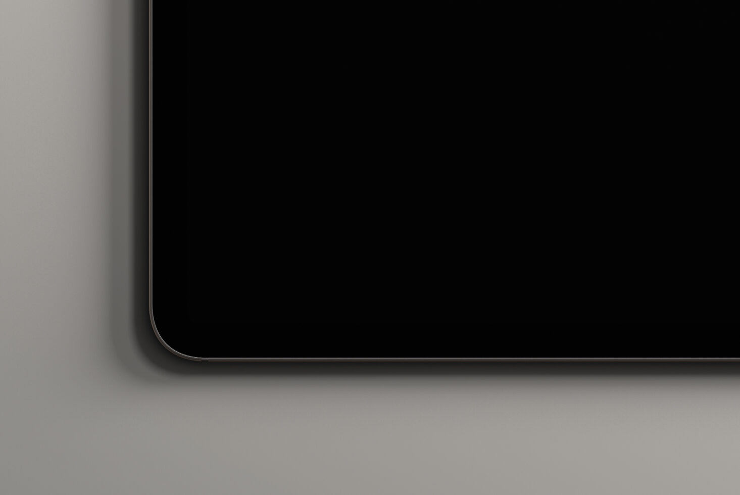 Minimal laptop corner mockup with curved edge on neutral surface