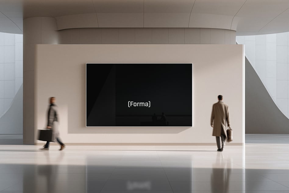Minimalist lobby with large wall-mounted screen displaying black background