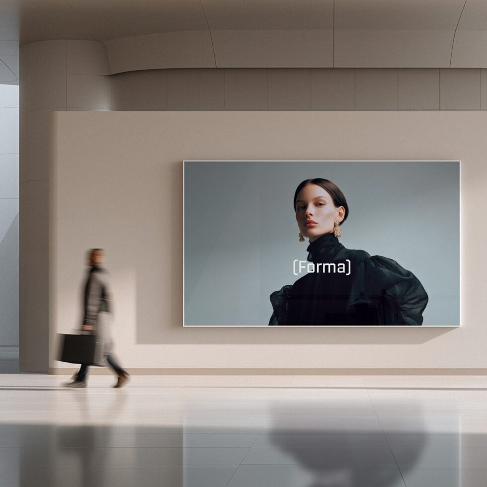 Clean exhibition space with large portrait screen in neutral tones