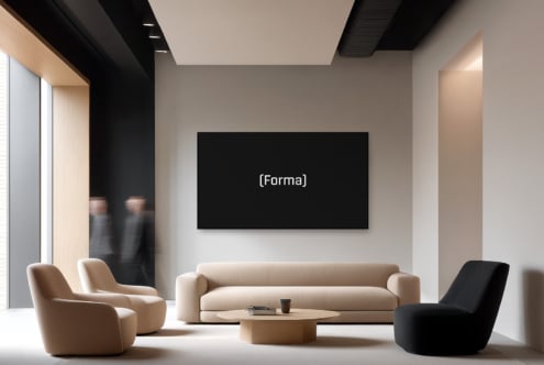Minimalist lounge with dark screen display on white wall above modern cream seating