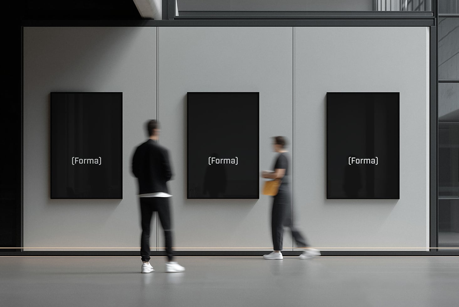 Three blank black framed posters on gallery wall with blurred passersby