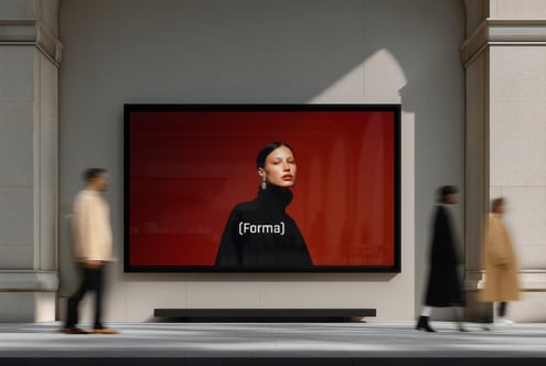 Woman in black turtleneck against red background on street-level gallery screen